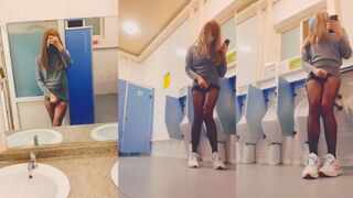 Asian she-male cums on black stocking in public toilet